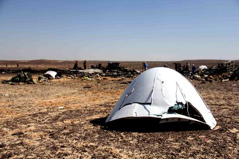 Debris of a Russian airplane is seen at the site a day after the passenger jet bound for St. Petersburg, Russia, crashed in Hassana, Egypt, on Sunday, Nov. 1, 2015. The Metrojet plane, bound for St. Petersburg in Russia, crashed 23 minutes after it took off from Egypt's Red Sea resort of Sharm el-Sheikh on Saturday morning. The 224 people on board, all Russian except for four Ukrainians and one Belarusian, died. (AP Photo)