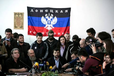 The head of pro-Russian separatists government Denis Pushilin speaks during news conference in regional government building in Donetsk